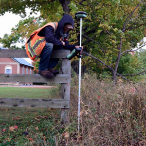 Surveyor on Fence